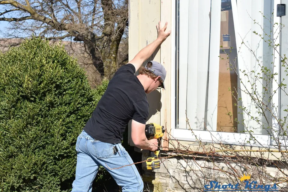 Fastening new window trim with a nail gun