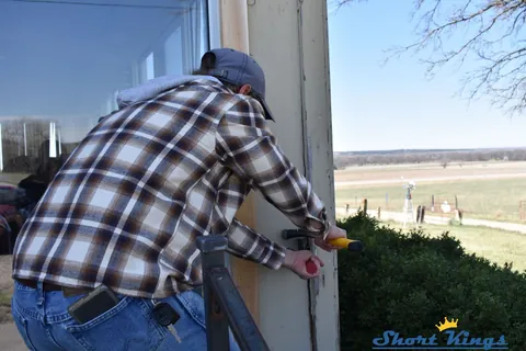 Using hand tools to remove old exterior door trim